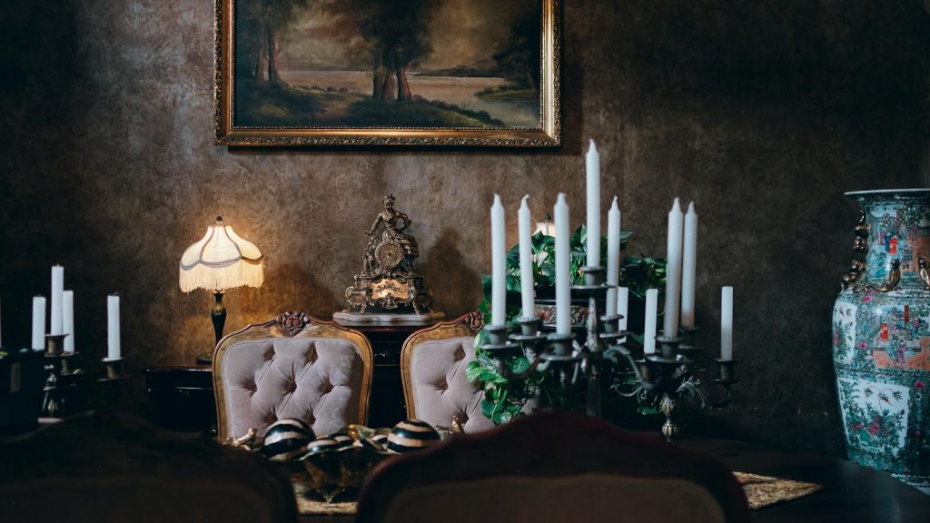 Sophisticated vintage dining room featuring elegant decor, candleholders, and classic artwork. Perfect for a luxurious setting.