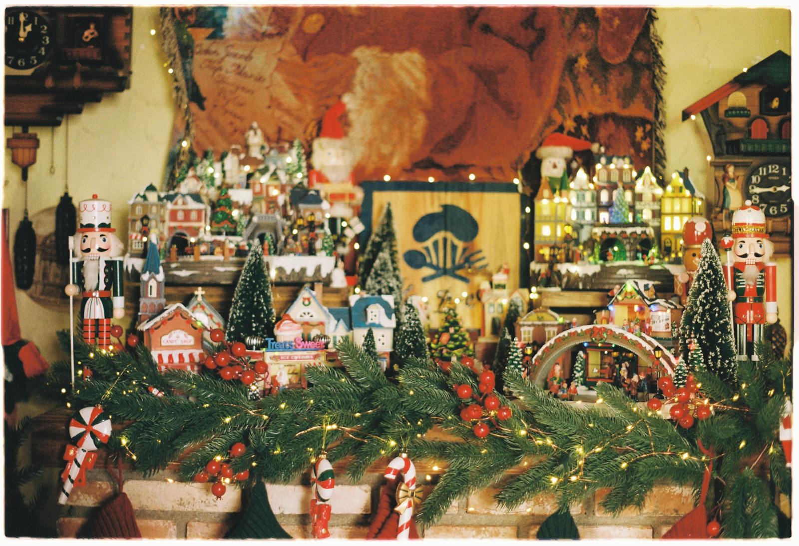 Festive Christmas display featuring nutcrackers, village houses, and holiday decor.