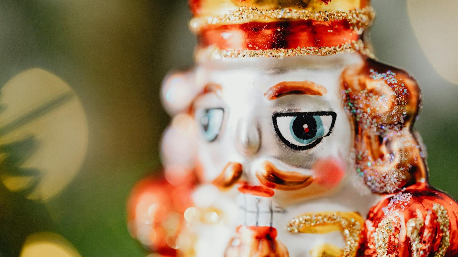 Close-up of a glittery nutcracker figurine, perfect for Christmas decoration.