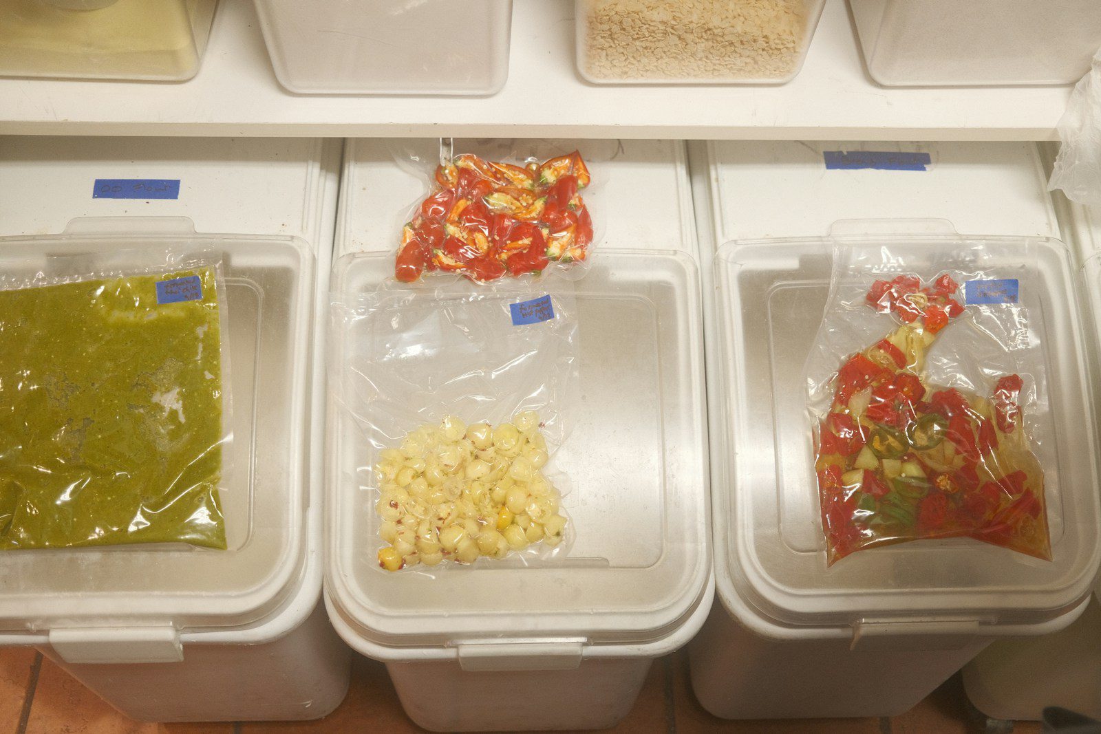 plastic containers filled with food sitting on top of a counter