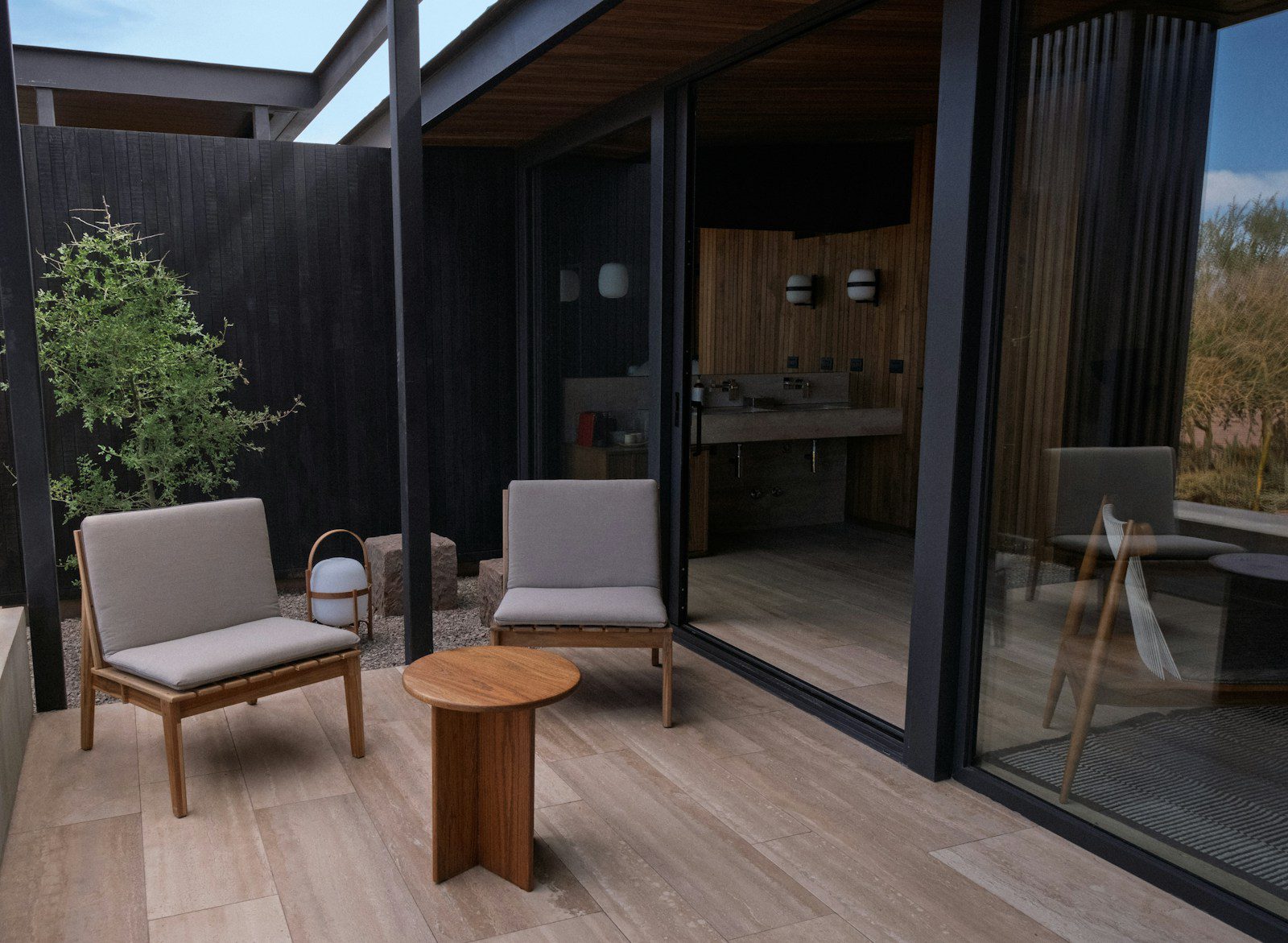 A living room with a couch a chair and a table