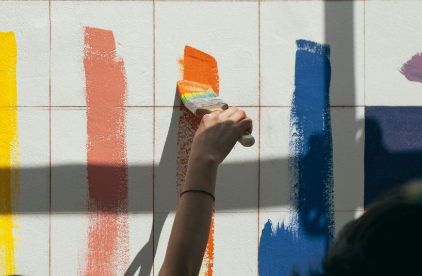 person painting wall