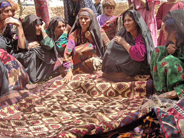 Widows in the Adraskan District of western Afghanistan voted to form an association to produce and market traditional wool carpets in a USAID funded project.