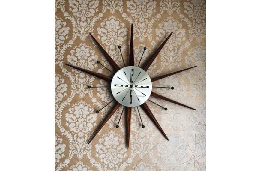 Vintage midcentury-modern starburst wall clock by Westclox, silver color with wood. Looks like 1960s.