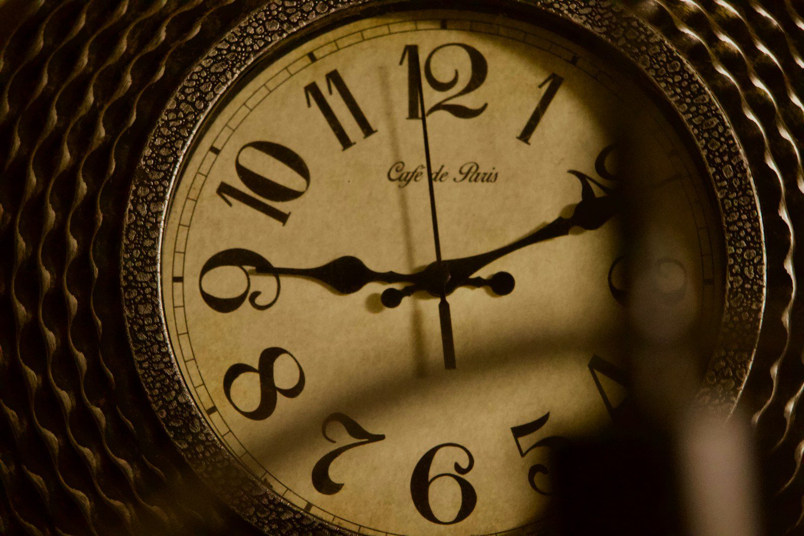 A close up of a clock on a table