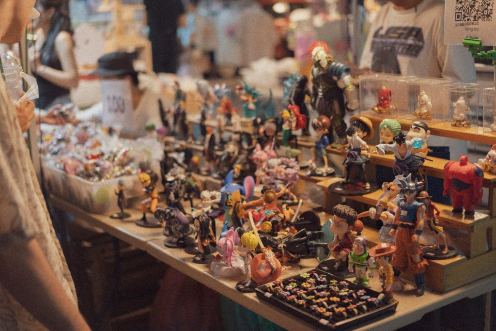 Display table filled with assorted collectible figurines.