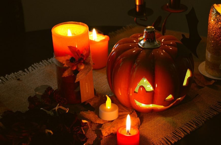 a table topped with lots of lit candles
