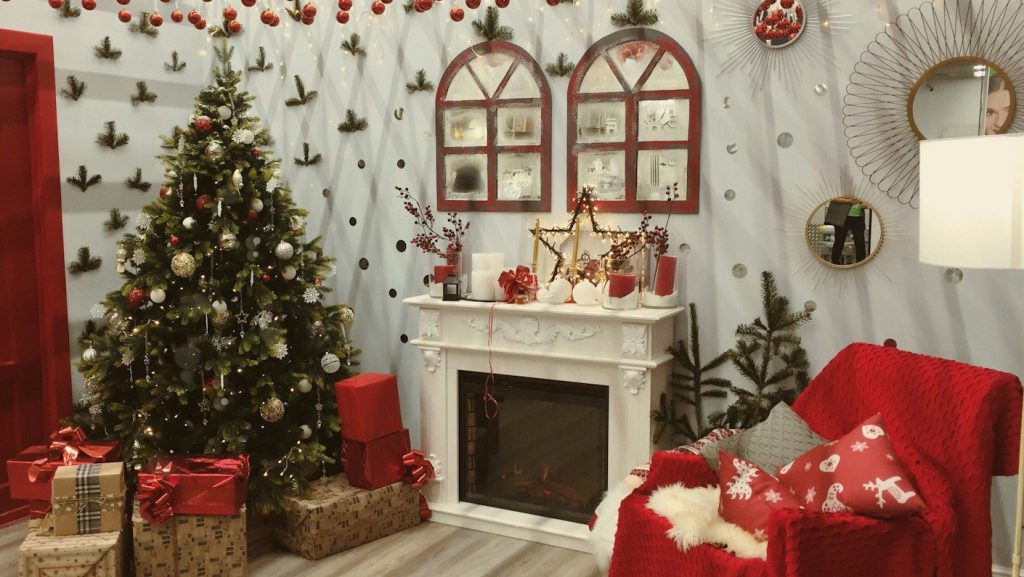 green christmas tree near the fireplace