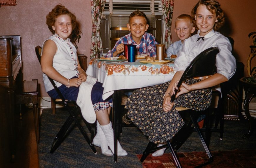 a group of people sitting around a table
