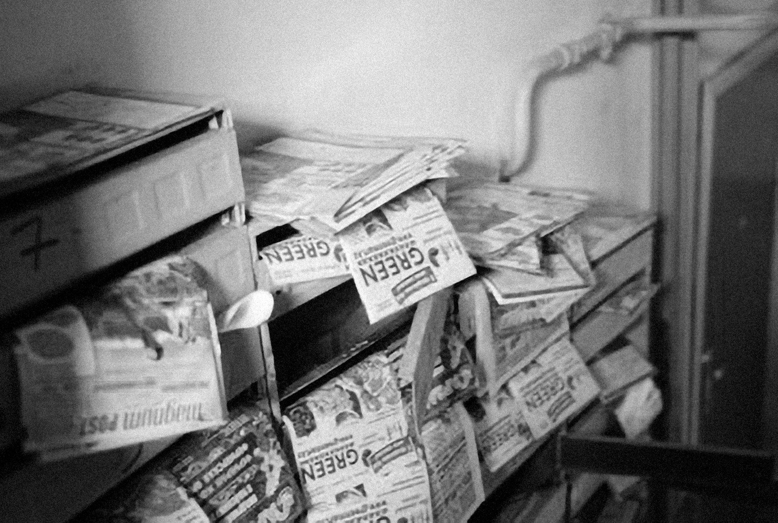a bunch of newspapers stacked on top of each other