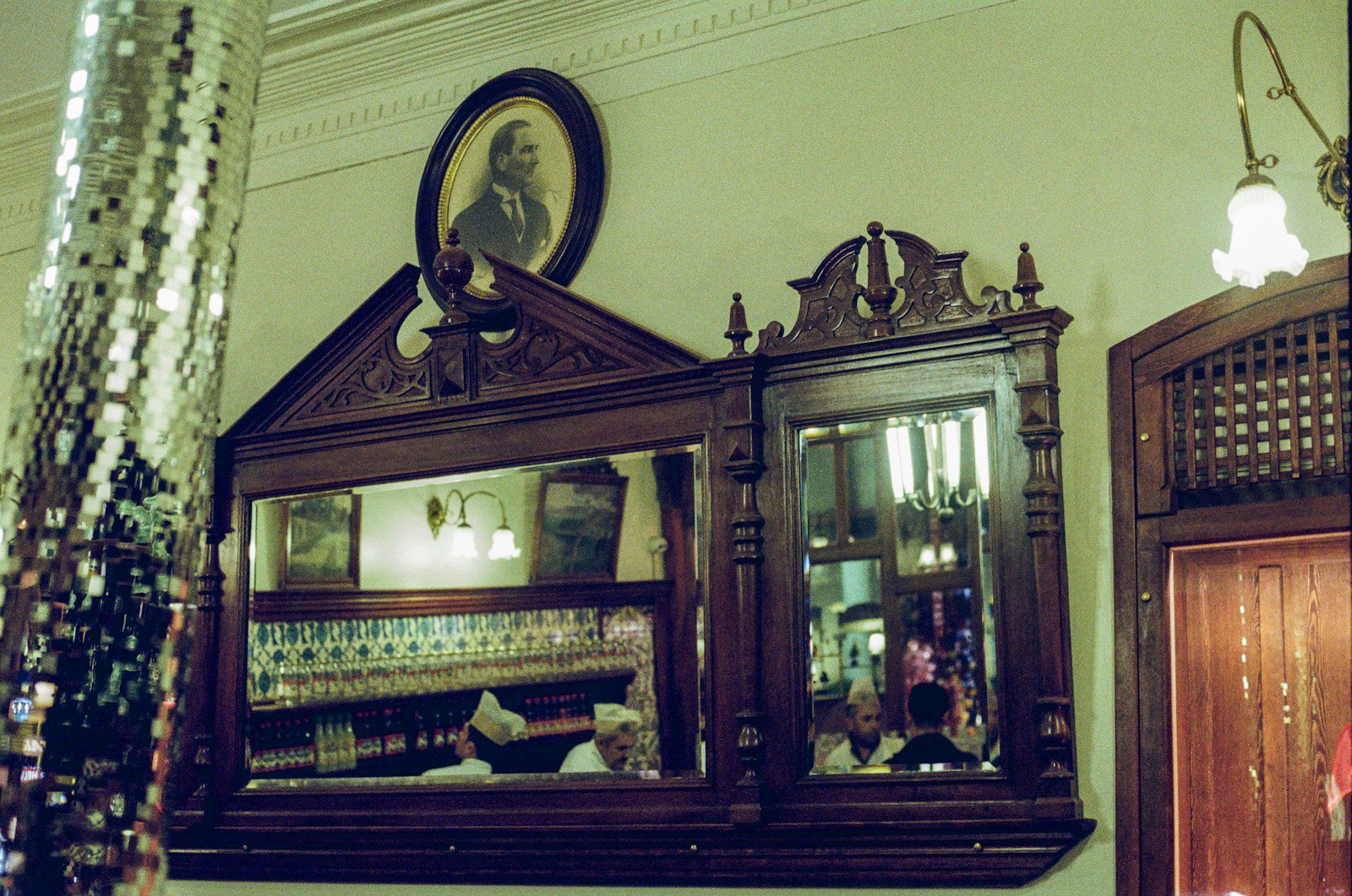 a mirror and a cabinet in a room