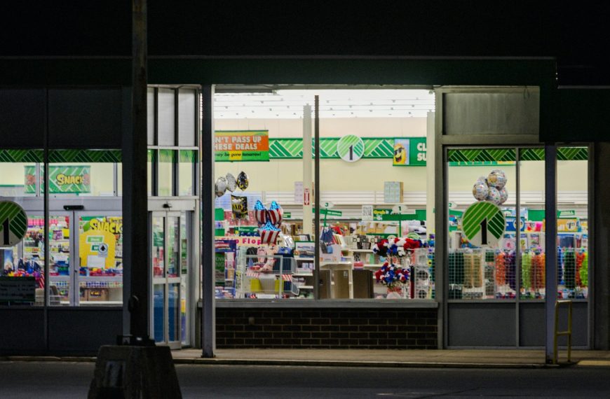 a store front at night with the lights on