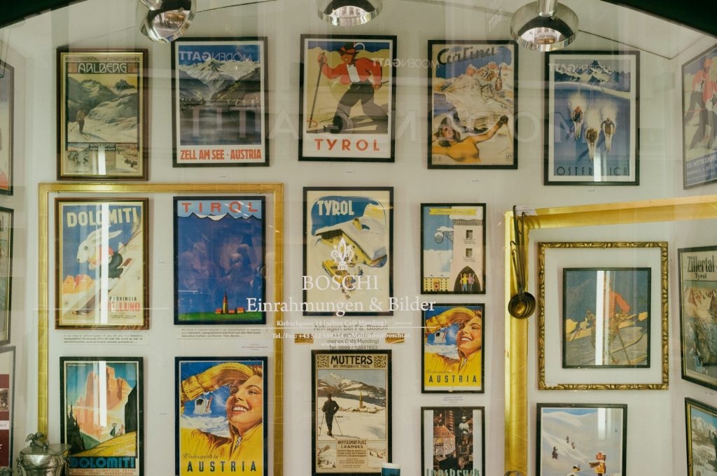 a wall with many pictures on it