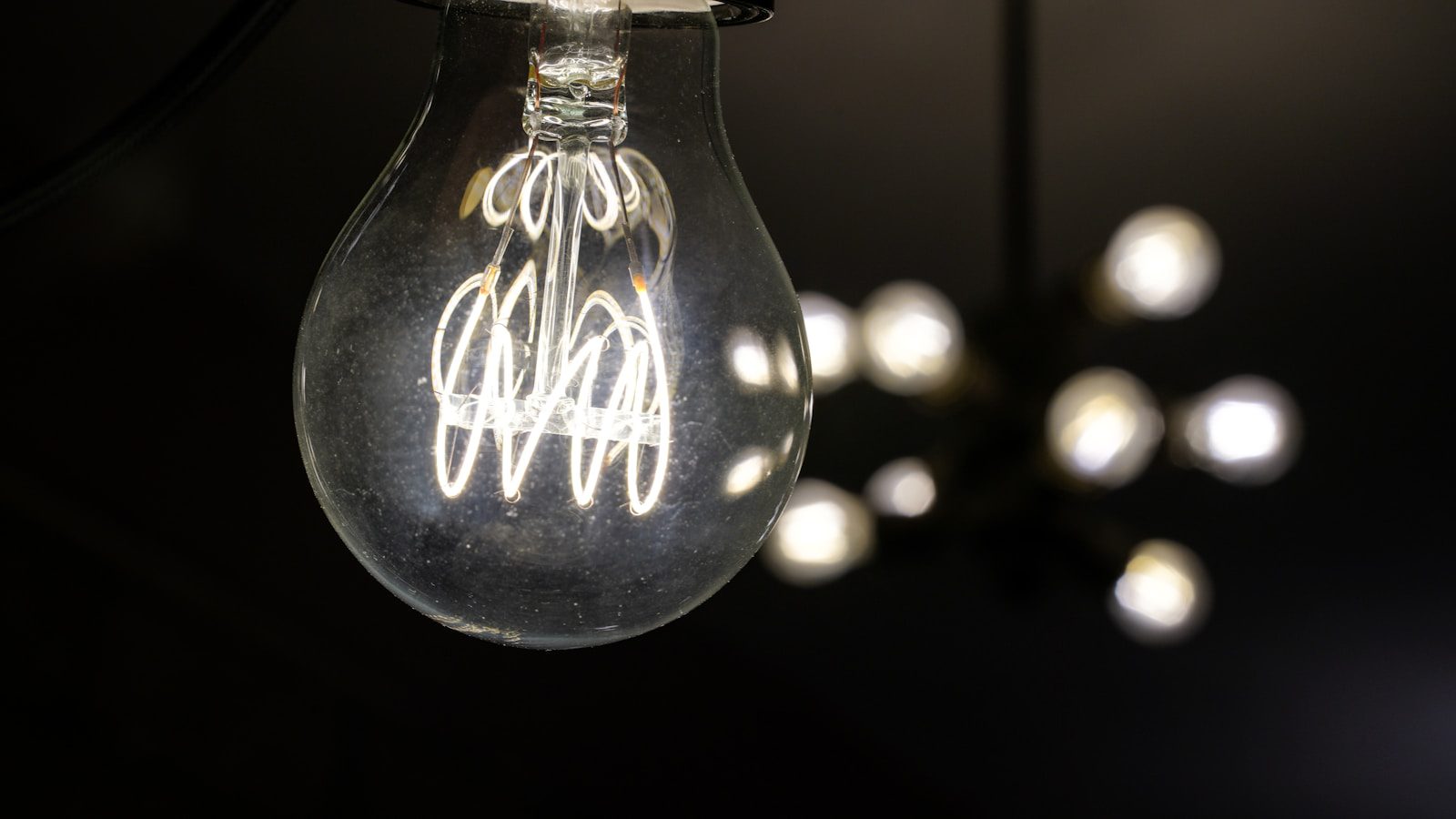 a glass bottle with a white label