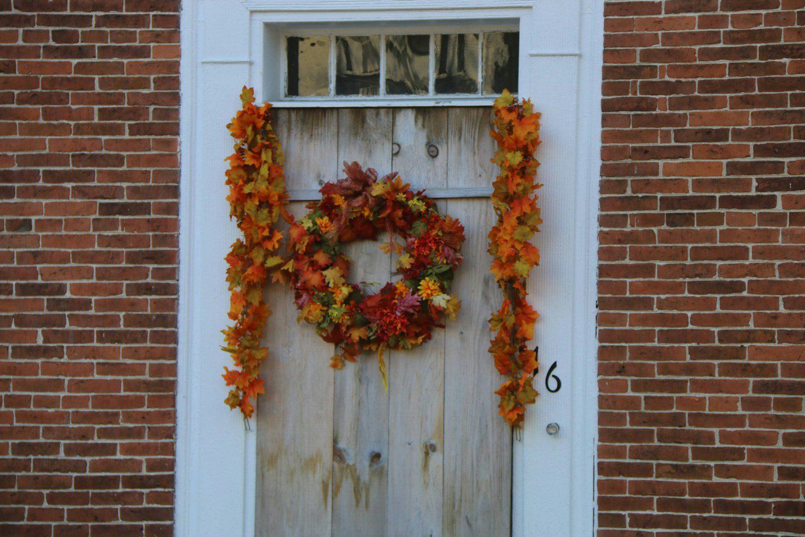a door with a wreath on it