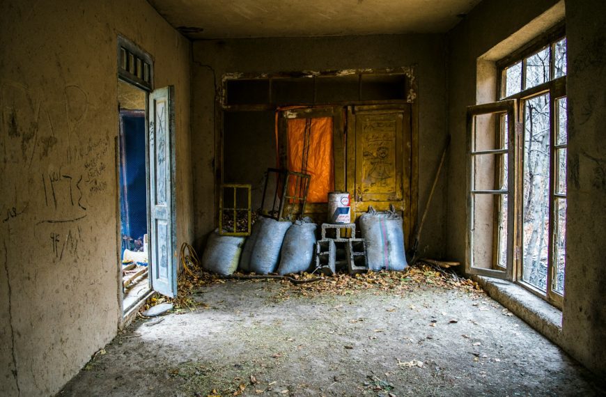 gray sacks on abandoned buidling