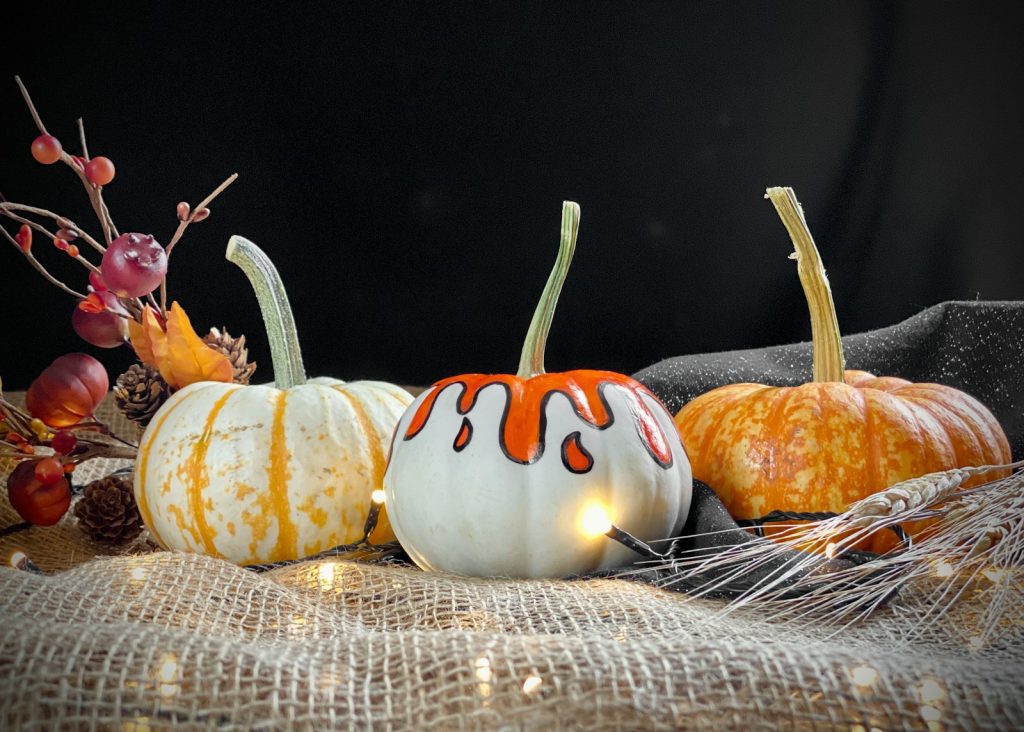 a group of pumpkins sitting on top of a table