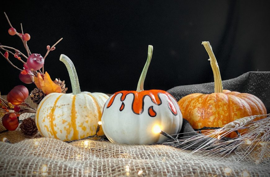 a group of pumpkins sitting on top of a table