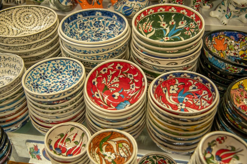 Stacks of colorful, patterned bowls are on display.