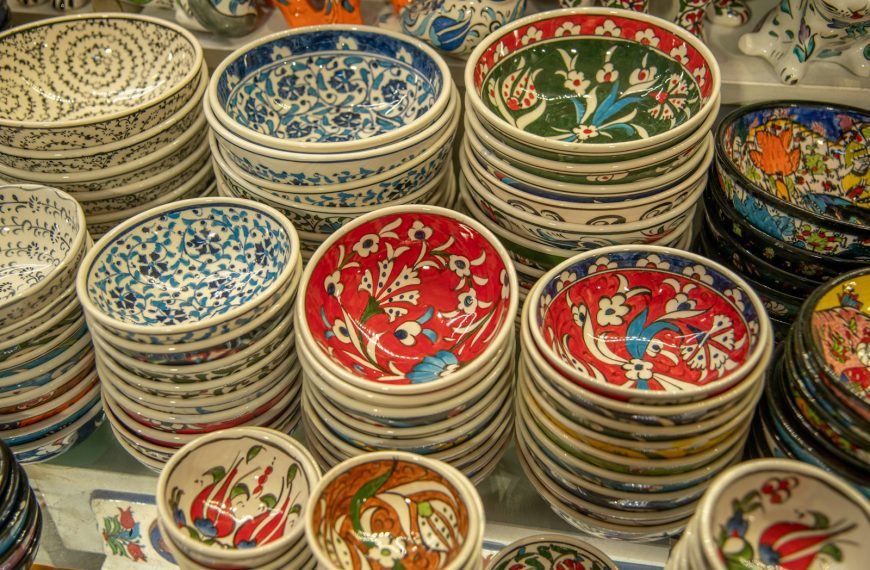 Stacks of colorful, patterned bowls are on display.