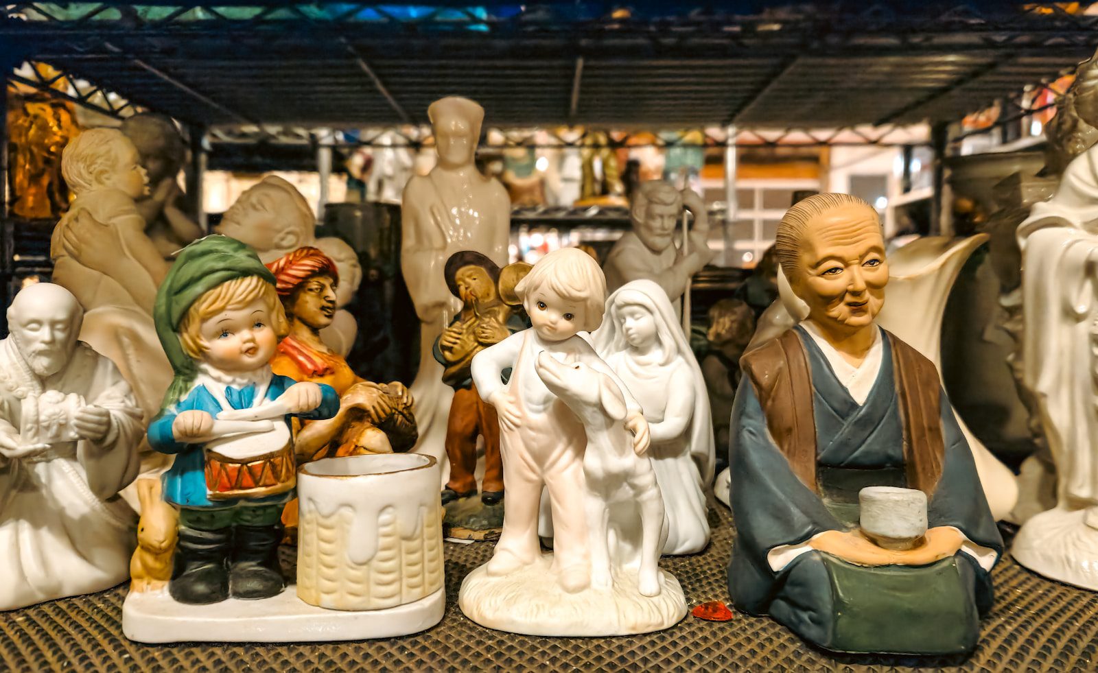 A group of ceramic figurines sitting on top of a table