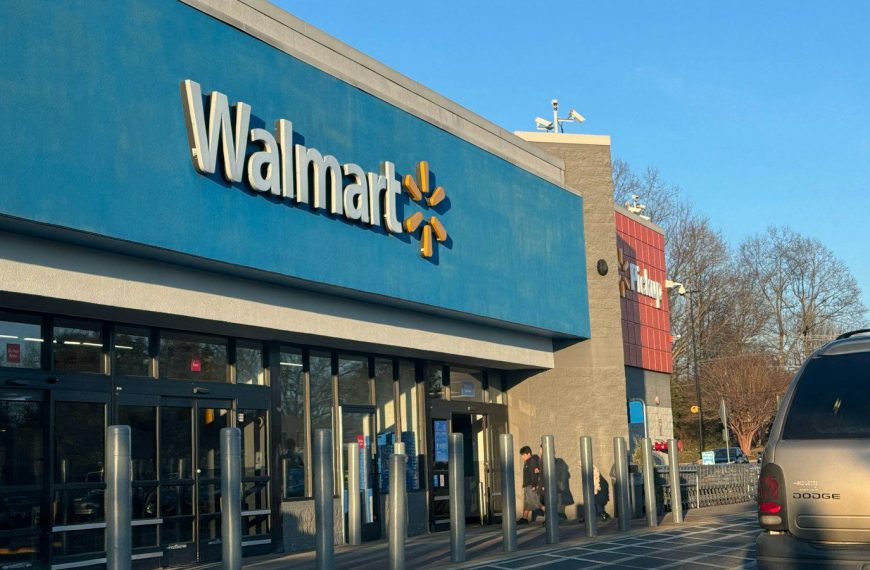 a walmart store with a car parked in front of it