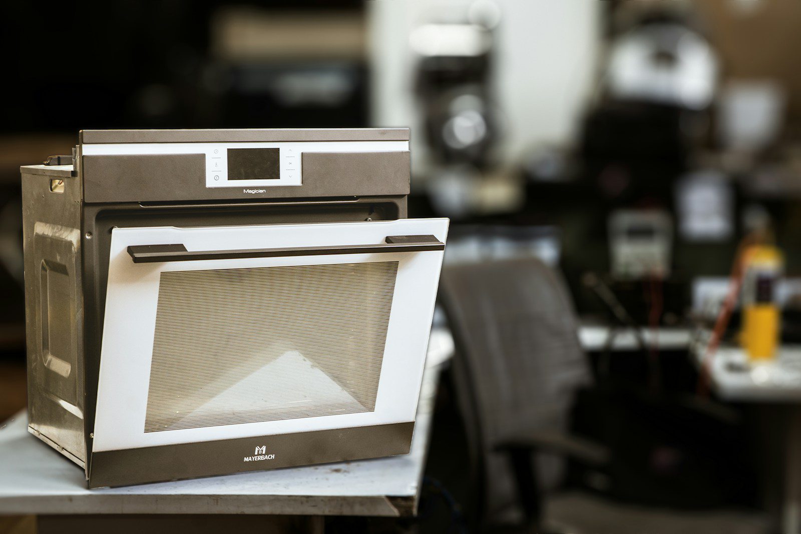 An oven is open in a kitchen.