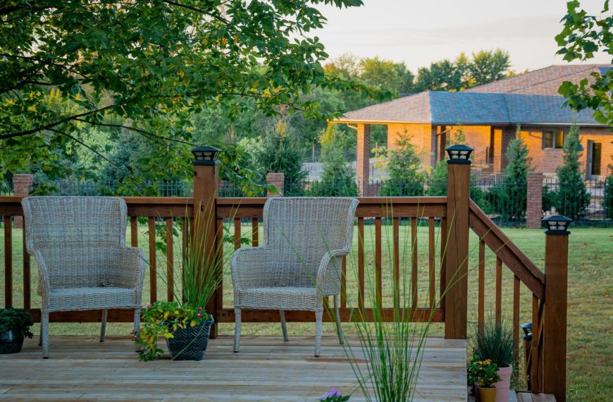 brown wooden fence near green trees during daytime
