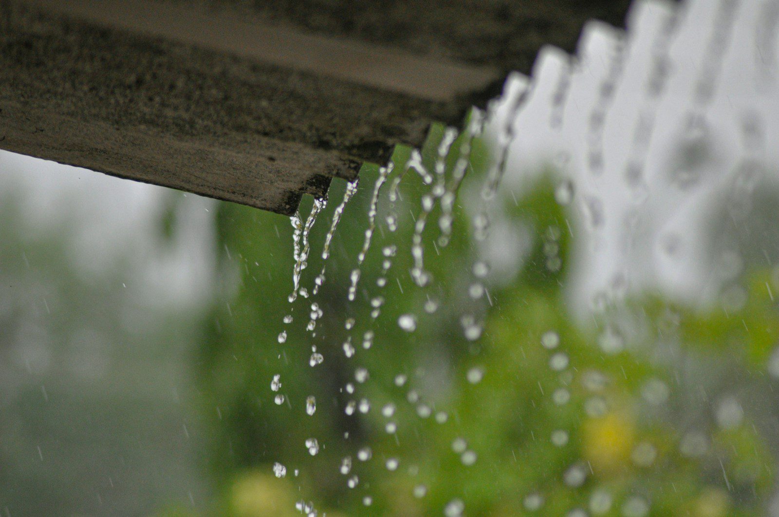 a rain gutter with water running down it