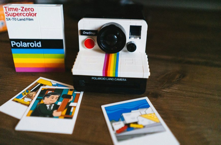 a polaroid camera sitting on top of a wooden table