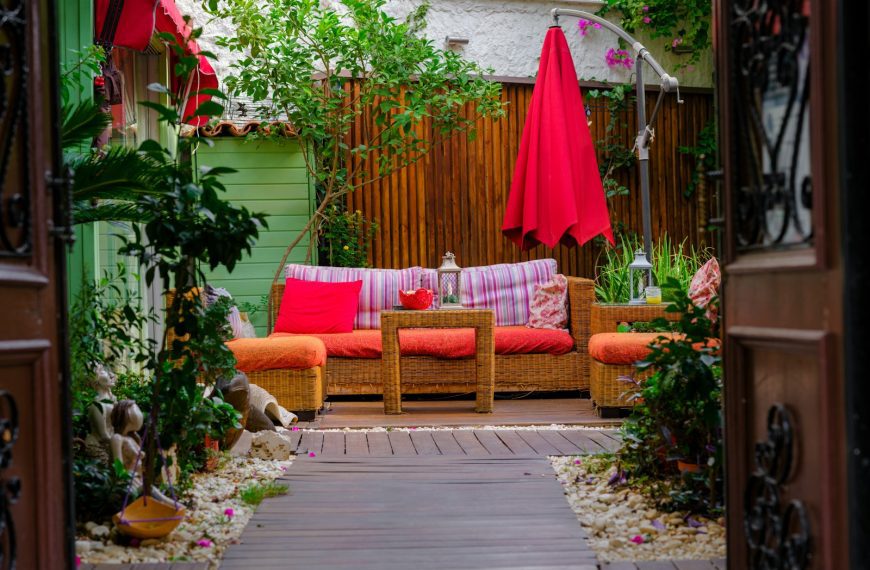 a patio with a couch and chairs