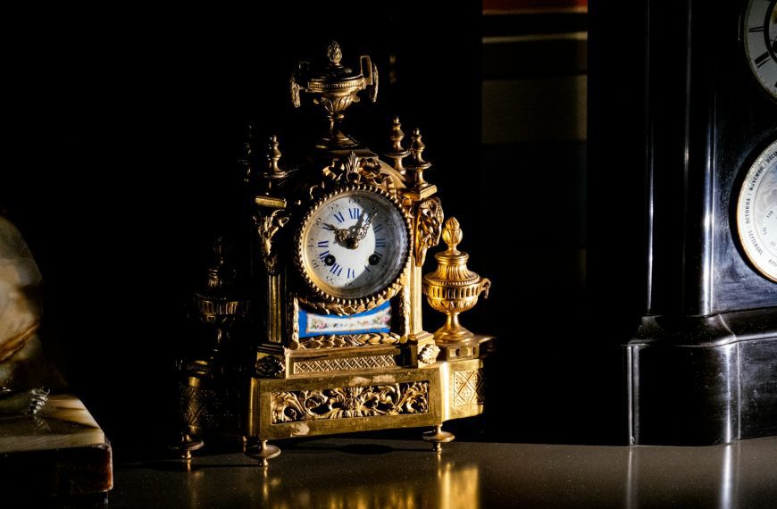 A couple of clocks sitting on top of a table