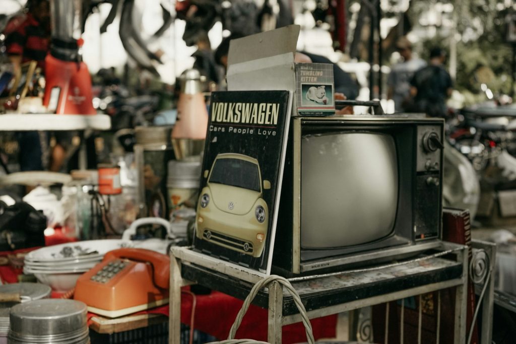 vintage black CRT TV on rack