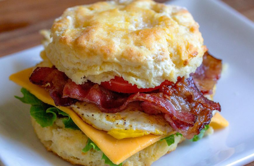Delicious breakfast biscuit sandwich with bacon, egg, and cheese. Perfect for breakfast lovers.