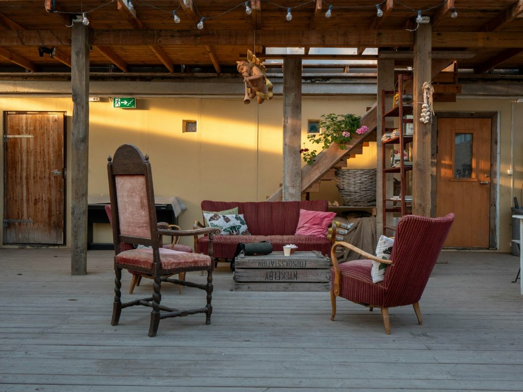 Cozy seating area with vintage chairs and sofa.