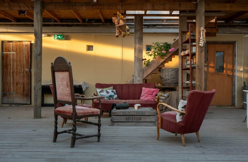 Cozy seating area with vintage chairs and sofa.