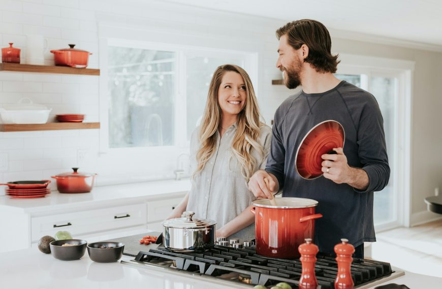 man and woman on kitchen