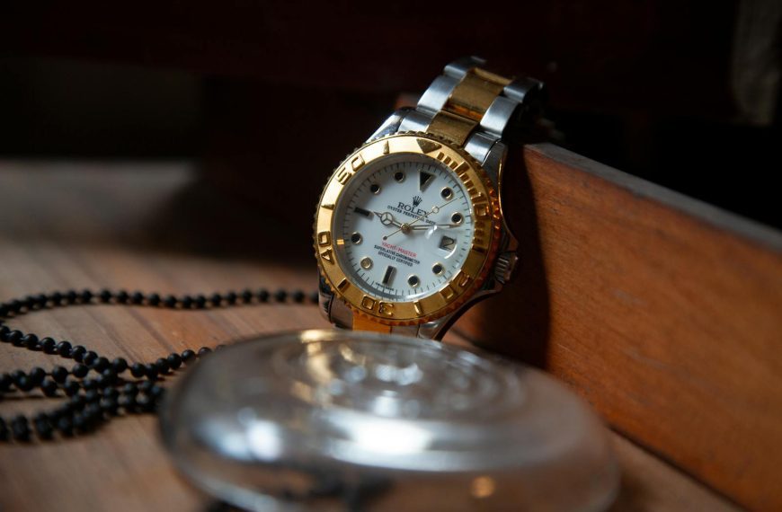 Close-up of a luxury Rolex wristwatch with gold and silver detailing, symbolizing elegance and precision.