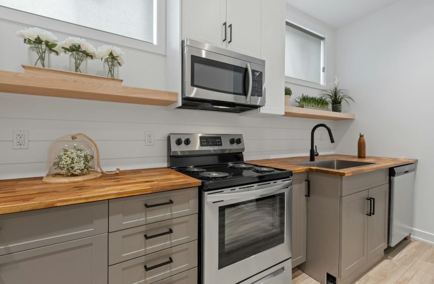 a kitchen with white cabinets