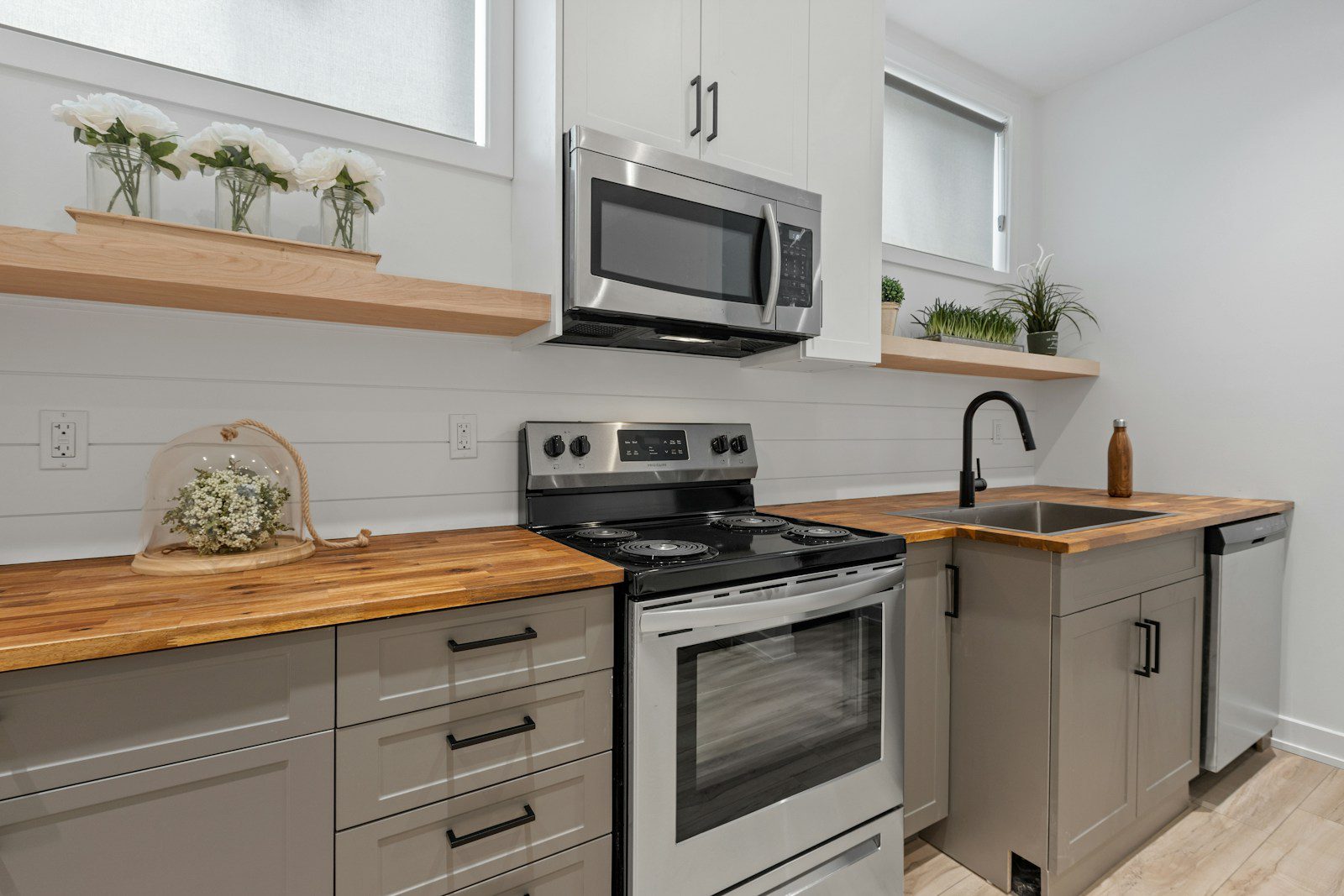 a kitchen with white cabinets