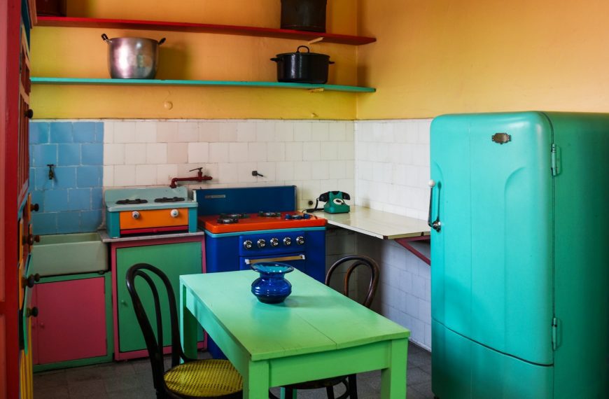 a kitchen with a table and chairs