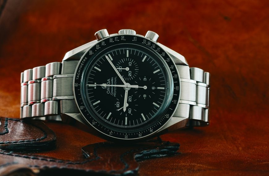 silver and black round analog watch