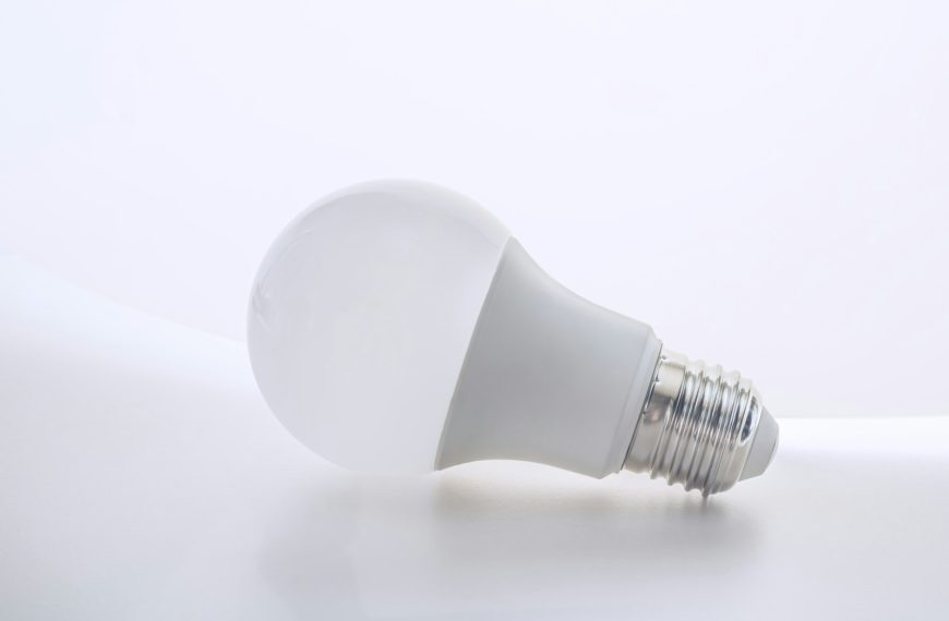a white light bulb sitting on top of a white table