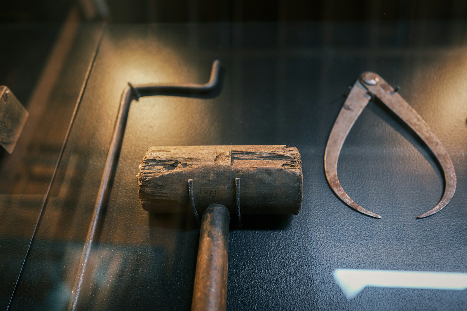 Antique tools including a mallet and calipers