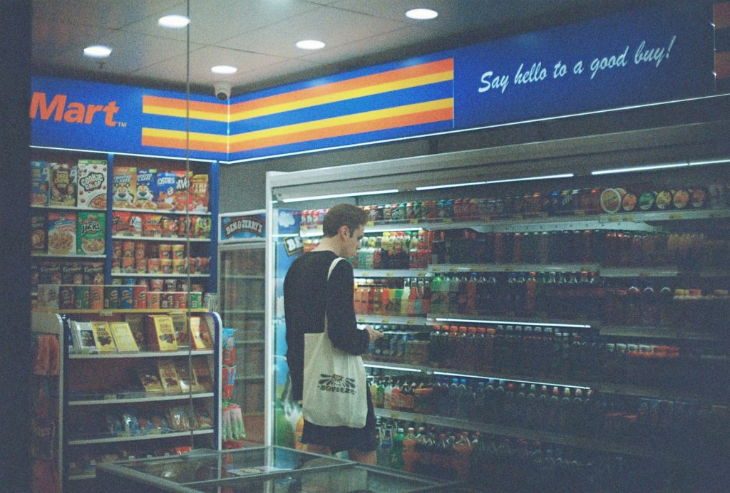 man in black shirt standing near the counter