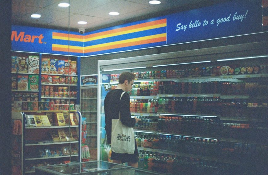 man in black shirt standing near the counter