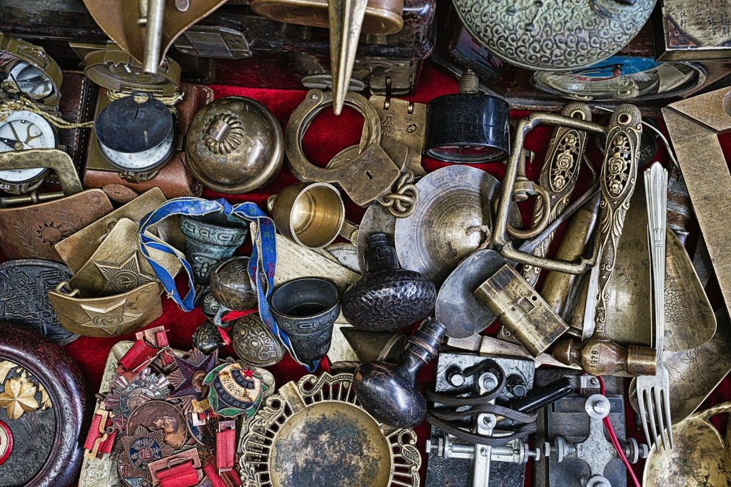 assorted-color metal vase and containers