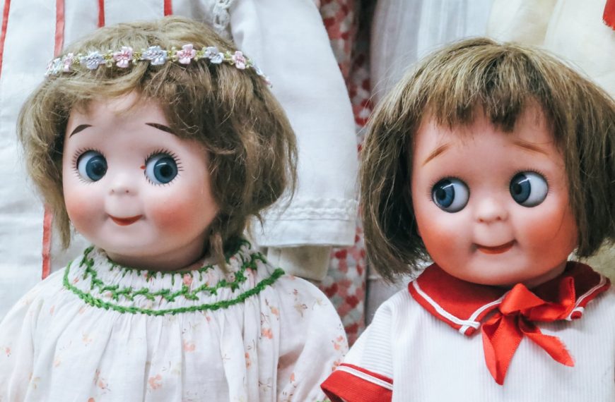 two female doll wearing white tops