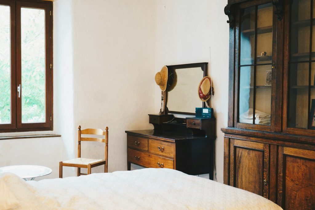 a room with a bed and a mirror