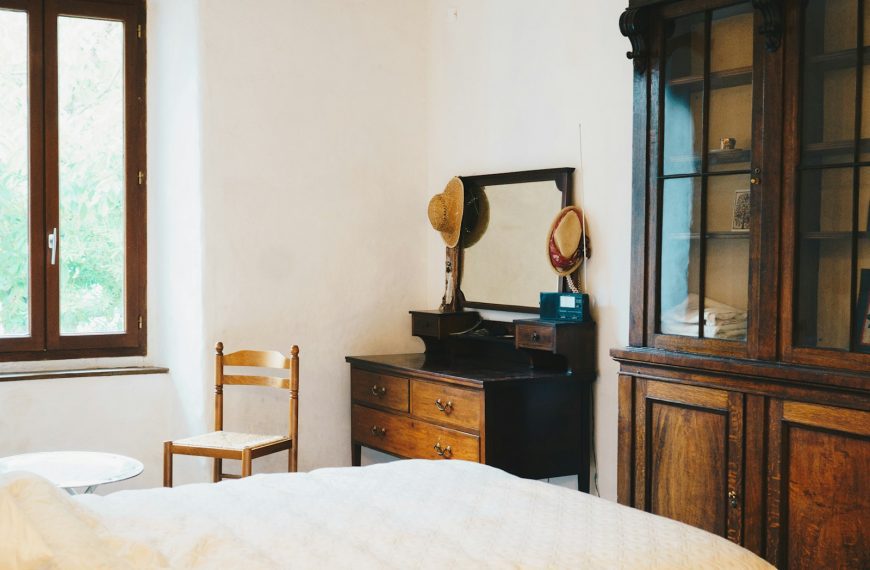 a room with a bed and a mirror